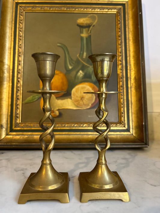 A delicate pair of Antique Brass Barley Twist Candlesticks